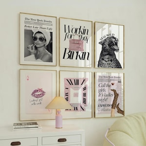 May include: A set of framed art prints with gold frames. The prints display fashion-related graphics, including a woman in sunglasses, a pink Birkin bag, a leopard, a playing card, a clock design, and a cocktail.