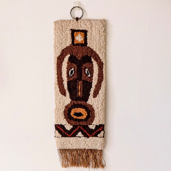 Vintage traditional fringed woven tapestry/wall hanging of traditional African mask