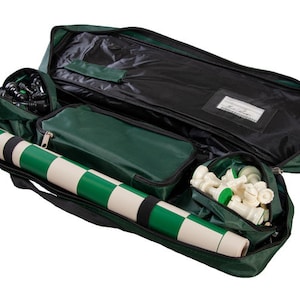May include: A green and black chess set carrying case with a zippered compartment, a rolled up green and white chess board, and a separate compartment for chess pieces.