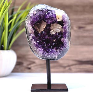 Natural Amethyst Geode with 3 Calcite Crystals – Unique Formation on Metal Stand
