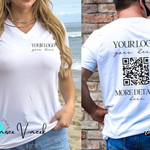 May include: White unisex V-neck t-shirt with the text "YOUR LOGO goes here" on the front and back. The back of the shirt also features a QR code and the text "MORE DETAILS here". The shirt is made of a soft material.