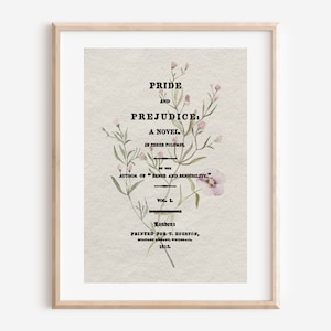 以下が含まれることがあります： 「Pride and Prejudice: A Novel」の額装されたプリント。花のアクセント付き。テキストには著者の名前と1815年の出版詳細が含まれています。アートワークは木製のフレームに入っています。