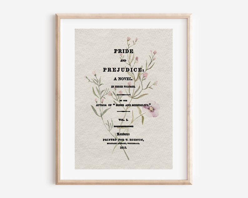 以下が含まれることがあります： 「Pride and Prejudice: A Novel」の額装されたプリント。花のアクセント付き。テキストには著者の名前と1815年の出版詳細が含まれています。アートワークは木製のフレームに入っています。