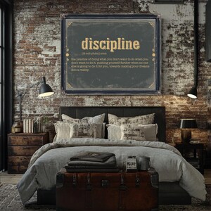 a bedroom with a brick wall and a poster above the bed