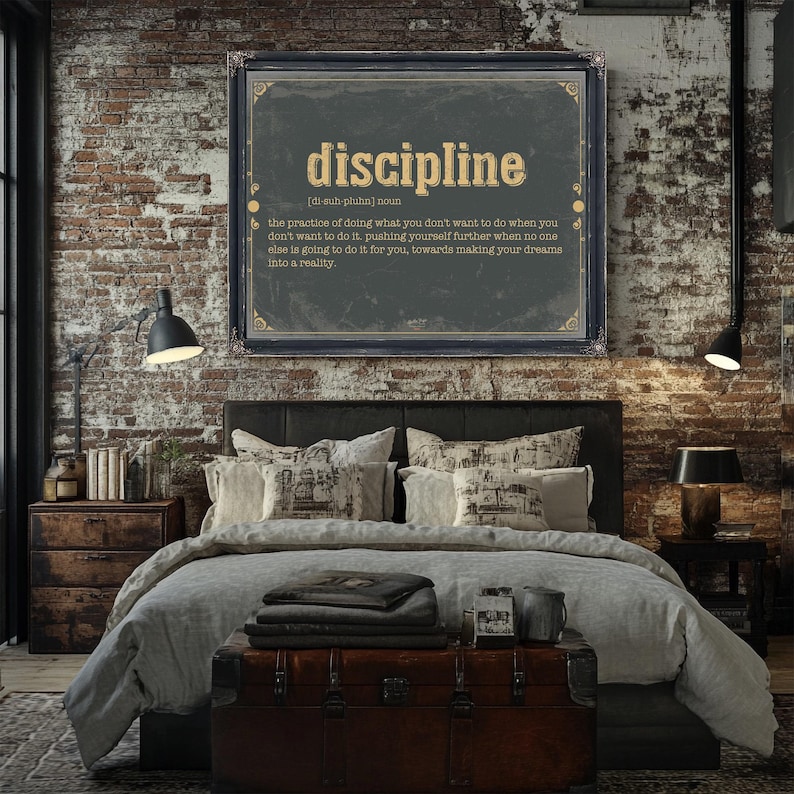 a bedroom with a brick wall and a poster above the bed