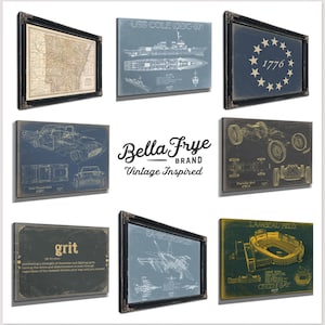 The image is a collage of various framed artworks and technical drawings, including maps, car illustrations, and technical drawings, all with a vintage-inspired aesthetic.