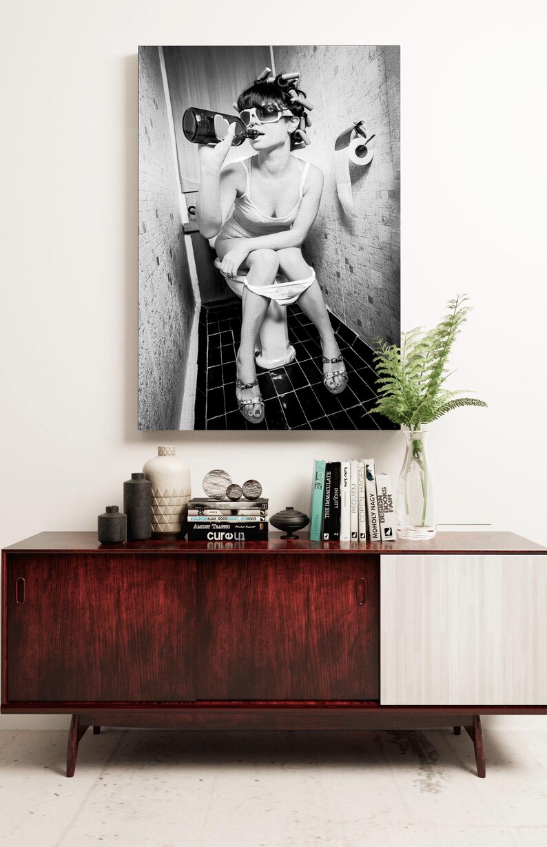Framed bathroom humor artwork, a perfect lighthearted print for powder rooms, bars, or man caves.