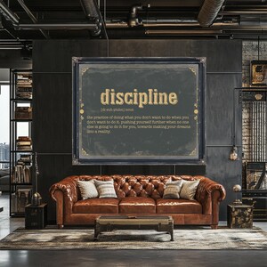 a living room with a couch and a large poster on the wall