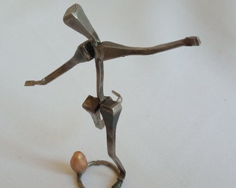 Stylized "transformation" rugby statuette in metal