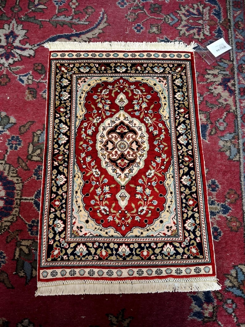 Crimson Medallion, handmade Kayseri silk rug, 64 × 43 cm