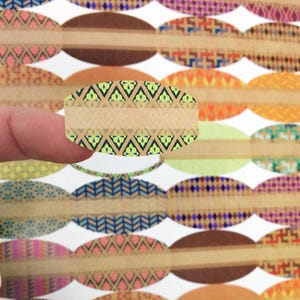 May include: A set of oval-shaped stickers with a variety of colorful geometric patterns. The stickers are made of brown paper with a white background. The stickers are perfect for adding a touch of personality to your gifts, crafts, and more.