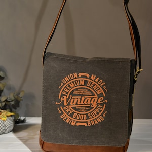 Sac messager en toile cirée d'inspiration vintage avec détails en cuir fin