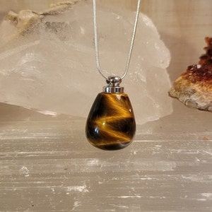 Natural Tiger's eye crystal aromatherapy perfume bottle with 925 sterling silver chain.