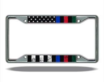 May include: A silver license plate frame with a black and white checkered pattern, a blue line, a red line, and a green line. The top of the frame has a black background with white stars.