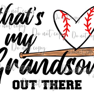 May include: A graphic design with the text "That's my Grandson OUT THERE" in black. A baseball bat and a baseball-shaped heart with red stitching are also featured.
