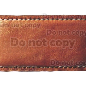 May include: A brown leather label with a stitched border. The label is blank and ready for text or a design.
