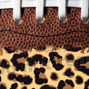 May include: Close-up of a brown leather football with white laces. The bottom half of the football is covered in a leopard print pattern.