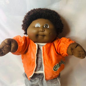 Vintage 1985 Cabbage Patch Kids AA Boy Doll OK Factory HM3 Brown Fuzzy Hair Black Signature Coleco Orange Jacket