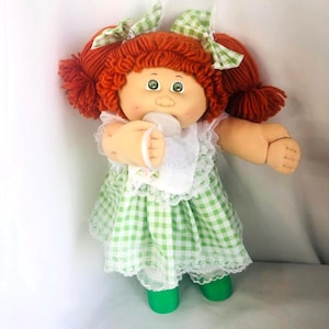 Muñecas Cabbage Patch Kids IC1 vintage, color azul de fábrica, pelo rojo, ojos verdes, ponis dobles y papeles.