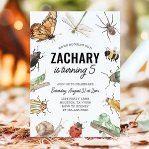 May include: A white invitation card featuring watercolour illustrations of insects such as a butterfly, dragonfly, and spider. The text reads "ZACHARY is turning 5" and includes party details. The invitation is for a birthday celebration.