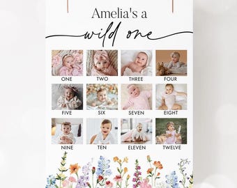 Puede incluir: Un póster blanco con el texto "Amelia's a wild one" y doce fotos de bebés. Las fotos están dispuestas en una cuadrícula, cada una etiquetada con un mes del uno al doce. La parte inferior del póster presenta un borde floral.