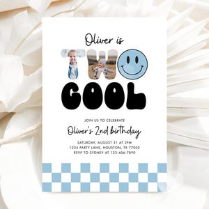 May include: A white invitation card with the text "Oliver is TWO COOL" and a blue smiley face. The card includes the text "Oliver's 2nd birthday" and event details. A light blue and white checkered pattern is at the bottom.
