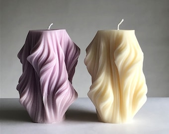 Decorative candle abstract artistic shape curves and contemporary clean lines of soy wax decoration