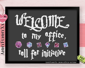 May include: A black and white cross stitch pattern with the text "WELCOME to my office, roll for initiative". The pattern features five colorful dice.