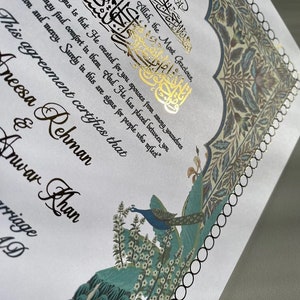 May include: A white wedding certificate with gold calligraphy and a peacock illustration. The text reads "The name of Allah, the Most Gracious, ... are signs for people who reflect." This agreement certifies that Aneesa Rehman & Anwar Khan.