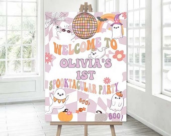 May include: A pink and white welcome sign for a 1st birthday party with the text "Welcome to Olivia's 1st Spooktacular Party". The sign features a disco ball, ghosts, pumpkins, and candy.