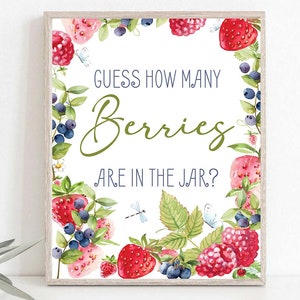 May include: A white printable sign with a green leafy border of berries, strawberries, and raspberries. The sign says "Guess how many berries are in the jar?"