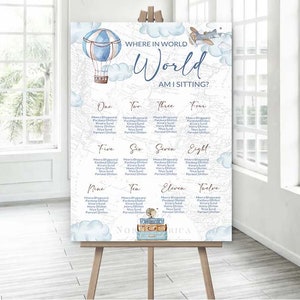 May include: A blue and white world map with a hot air balloon and airplane graphic. The map is divided into twelve sections, each with a number and a list of names. The text at the top reads "Where in the world am I sitting?" and "World".