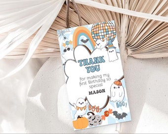 May include: A blue and white thank you card with a ghost theme. The card says "Thank You" and "For making my first birthday so special Mason". There are ghosts, pumpkins, bats, and candy corn on the card.
