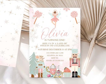 May include: A pink and blue invitation for a first birthday party with a snowflake and star design. The invitation says "Olivia is turning one! Join us in a land of sweets to celebrate Saturday December 15 at 1pm 1234 Snowflake Lane Kelowna, BC 95142 RSVP to Kinara at 123.595.2312".