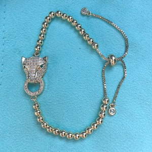 B-3 Cubic Zirconia Leopard charm and 18k Gold-plated beads sliding knot adjustable bracelet, Shiny and Sparkly, ease of wear bracelet