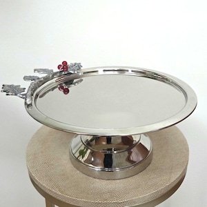 Chrome metal cake stand Dessert display with leaves and red berries