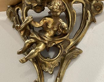 Antique Rococo Pair Of Gilded Cherub Wall Shelves. Solid Brass with Gilt Wood Shelf Top. Rococo Brass Cherub Wall Shelf-. 10"h x 11 3/4"w.