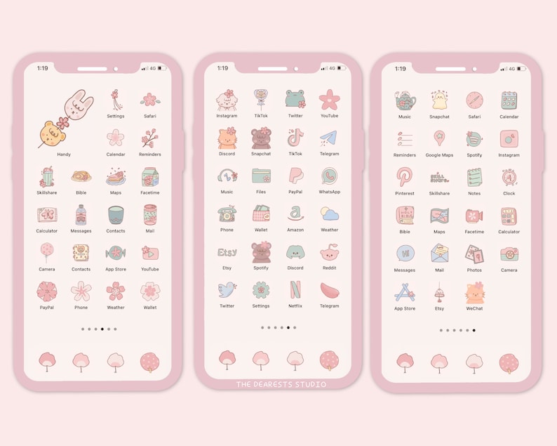 Op de afbeelding: Een roze en wit telefoonscherm met een raster van kleurrijke app-pictogrammen. De pictogrammen zijn gestyled met schattige cartoonfiguren en bloemmotieven. De tekst "THE DEARESTS STUDIO" staat onderaan het scherm.