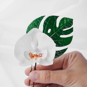 White orchid hair pin and monstera leaves. Tropical hair flower, orchid hair clip . tiki hair flower for hawaii wedding