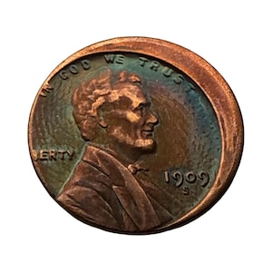 May include: A copper-toned 1909-S Lincoln cent coin featuring the profile of Abraham Lincoln facing right. The text IN GOD WE TRUST is arched across the top, with LIBERTY on the left and the year 1909 and mint mark S on the right side.