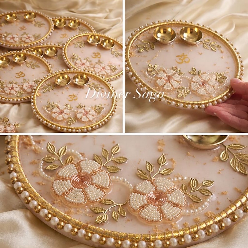 May include: Decorative round tray with a light pink background, adorned with beaded flowers, gold accents, and small brass bowls. The tray has a pearl border and the Om symbol. The text "Diviner Saga" is visible.