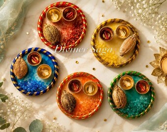 May include: A collection of five colorful decorative plates. Each plate features a unique color scheme, including red, yellow, blue, orange, and green, with gold accents and a woven rope border. The plates contain small bowls and a seed. The text "Diviner Saga" is visible.
