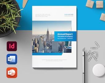 May include: A white and blue annual report cover with a cityscape photo of New York City. The text on the cover reads "Annual Report", "The name of Company", "Your Activity Here", and "2000/2012".