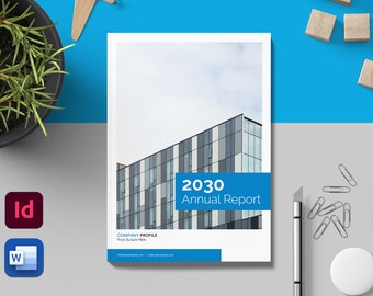 May include: A white and blue annual report cover with the text "2030 Annual Report" in blue. The cover features a photo of a modern office building with a cloudy sky in the background.