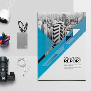 May include: A white and blue annual report cover with a black and white photo of a city skyline. The text "ANNUAL 2017/18 REPORT" is printed in black.