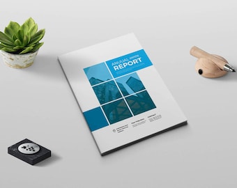 May include: A white and blue annual report cover with a photo of a city skyline. The text "ANNUAL 2023 REPORT" is in a blue box.