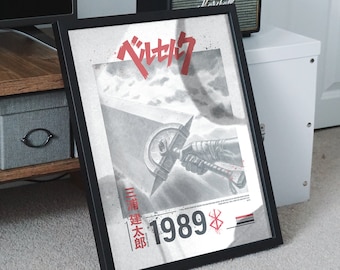May include: A black framed poster with a white background and a red Japanese character for "Berserk" in the top left corner. The poster features a black and white illustration of a hand holding a large sword with a red blade. The text "1989" is in red and the text "三浦建太郎" is in black.