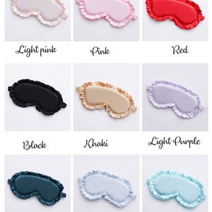 May include: Nine different colors of sleep masks with ruffled edges. The colors are light pink, pink, red, black, khaki, light purple, dark green, light blue, and tiffany blue.