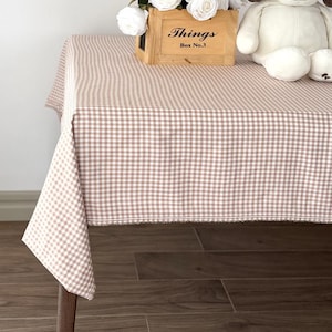 May include: A set of three ceramic mugs with a speckled, matte finish. The mugs are in shades of cream, light gray, and dark gray. Each mug has a simple, minimalist design, perfect for coffee or tea.