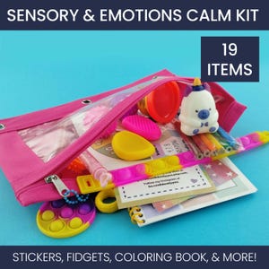 May include: A pink pencil case filled with sensory items. The case contains a variety of items, including a pop-it bracelet, a small notebook, a unicorn figurine, and a container of playdough. Text on the image reads "Sensory & Emotions Calm Kit" and "19 Items."